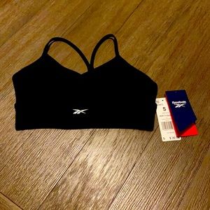 Black medium impact Reebok sports bra in size small. Never washed or worn
